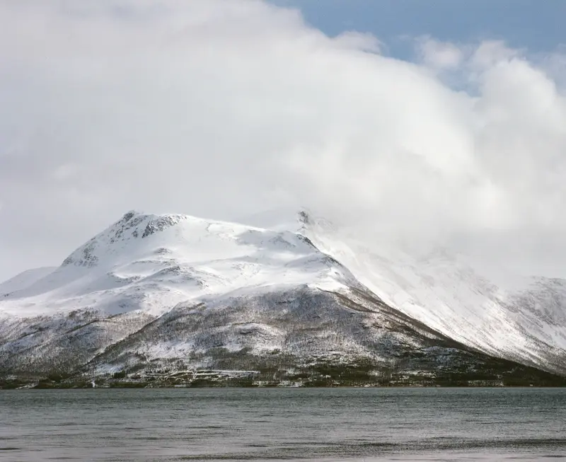 Snow peak over the fjord